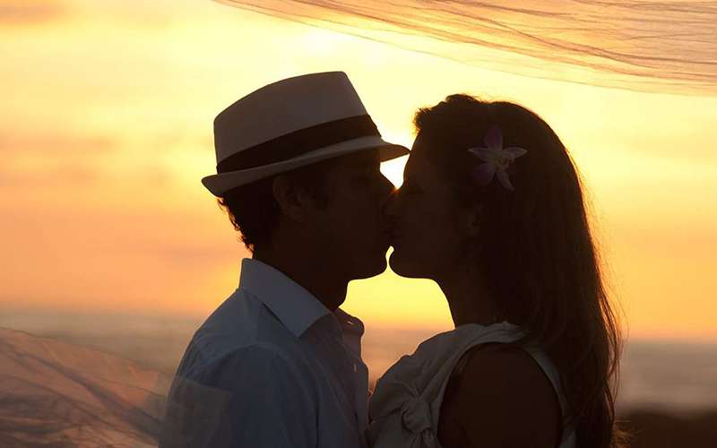 Couple kissing at the beach