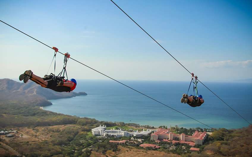 Zip lining in Guanacaste Costa Rica allows great views of the ocean and the forest while having a blast. This is the Superman of Diamante Eco Adventure Park.