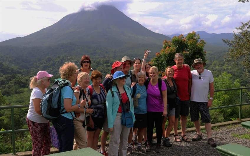 Group's picture in the back Arenal Volcano